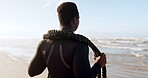 Beach, black man and battle rope for fitness, workout and training with endurance, strength and wellness. Strong, african person or bodybuilder with ropes by ocean for exercise, cardio and sports