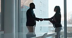 Business people, handshake and partnership in office with silhouette of b2b meeting, collaboration or support for project. Businessman, shaking hands and thank you for contract, deal or work success