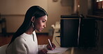 Woman, student and writing notes on computer for studying, e learning and planning goals, ideas and education. Young person with notebook and desktop pc on university campus or online course at night