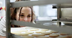 Bakery, kitchen and happy woman with cookies in oven for business, customer and breakfast in restaurant or diner. Cooking, professional baker and cake for dessert, lunch or eating with smile in cafe