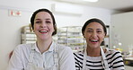 Women, face and laughing in bakery with employees, apron and working in cafe kitchen with service and catering. Portrait, baker team and happy with arms crossed, confidence and professional chef