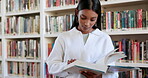 Reading, books and education with woman in library for research, learning and college. Knowledge, university and student with person and relax at school for information, studying or academic project 