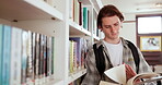 College, books and learning with man in library for education, research and relax. Knowledge, university and student with person reading at school for information, studying and academic project 