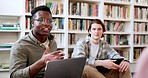 Library, study laptop and student group with conversation and book planning for college project. People, talking and communication for learning and studying for exam with friends for university class