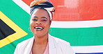 Black woman, face and smile for South Africa, flag and pride in country, happiness and fabric with model. Patriotic, citizen in portrait and nationality with confidence, positivity and symbol