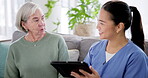 Tablet, medical and nurse with old woman on sofa for consulting, help and communication. Healthcare, retirement and support with caregiver and patient in nursing home for insurance and advice