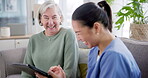 Tablet, consulting and nurse with old woman on sofa for medical, help and communication. Healthcare, retirement and support with caregiver and patient in nursing home for insurance and advice