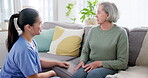 Healthcare nurse, senior woman and consultation for therapy in nursing home for medical wellness and hospital support on sofa. Doctor, patient and caregiver with happiness and conversation on couch