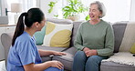 Healthcare nurse, senior woman and retirement consultation in nursing home for medical wellness and hospital support on sofa. Doctor, patient and caregiver with happiness and conversation on couch