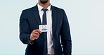 Business card, logo and man hand with corporate conference pass for seminar and workshop in studio. Sales, promo and advertising for employee trade show with professional in suit with blue background