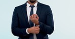Fashion, suit and cuff with a business man getting ready closeup in studio on a white background. Arm, professional and style with a confident corporate employee dressing for the start of work