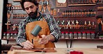 Leather work, man in workshop with tools and craft manufacturing of unique textile product. Hammer, fabric and craftsman at tannery factory with pattern, service and repair process with suede texture