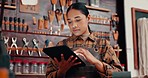 Leather workshop, woman with tablet and tools for manufacturing of unique textile product. Ecommerce, small business owner and girl at factory with online checklist, digital app and repair service.