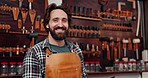 Leather workshop, portrait of happy man with tools, craft manufacturing and unique textile product. Smile, small business owner and factory craftsman with confidence, pride and repair service store.