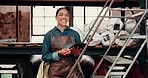 Woman, factory and ladder by shelf for smile on face, tablet or fabric for textile manufacturing in workplace. Girl, storage and inspection for stock, material or cloth for quality assurance with app
