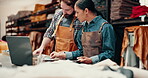 Leather work, color palette and material for textile choice with man and woman, attention and detail in shop. Employees, people and laptop for research on texture and product for customer or design