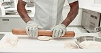 Chef, hands and dough on a restaurant kitchen counter for cooking or catering job. Professional baker person working with food and rolling pin for pastry, pizza or baking recipe for a bakery or hotel