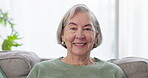 Smile, face and a senior woman on the sofa for relax, comfort and a break in retirement. Happy, living room and portrait of an elderly person in a nursing home for calm, confident and positivity