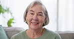 Face, happy or old woman on sofa in retirement at nursing home for elderly care in house lounge. Pride, laughing or portrait of proud senior person on couch in house in retirement in living room