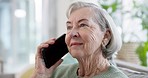 Phone call, relax and senior woman on a sofa in the living room for discussion, gossip or communication. Technology, rest and elderly female person in retirement on mobile conversation with cellphone