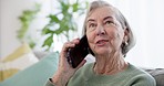 Phone call, smile and senior woman on sofa in the living room for discussion, gossip or communication. Technology, relax and elderly female person in retirement on mobile conversation with cellphone.