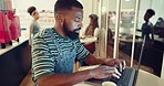 Cafe, creative and black man with a laptop, typing or ideas with journalist, online reading or research. African person, editor or writer in a coffee shop, pc or update website with planning or email