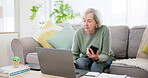 Senior woman, computer and phone on sofa for planning, investment research or asset management website at home. Elderly person typing on mobile and laptop for financial information or pension FAQ