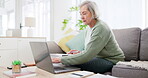 Laptop, writing and documents for accounting with an old woman in the living room for retirement planning. Computer, finance and investment for pension with a senior adult on a sofa in her home