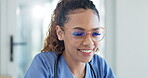 Doctor, woman and happy on computer for healthcare results, news and clinic management or research. Young african nurse with glasses and technology screen reflection for medical internship and vision