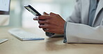 Hands, phone and typing closeup at desk in office, business and networking on social media. Smartphone, professional and person on internet at table, scroll on email and communication on technology