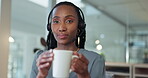 Call center, woman and headphones with coffee and smile for customer focus, telemarketing and consulting. Office, black person and happiness with tea for break, resting and relax at work company
