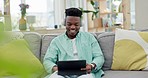 Home, headphones and black man with tablet, streaming music and radio with connection, relax and sound. African person, headset and guy on a couch, technology and listening to audio with digital app