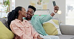 Selfie, morning or black couple on social media to relax together at home on living room sofa. Hug, woman or happy man taking picture or photo to bond with love, support or smile on an online post 