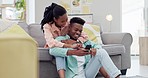 Home, love or black couple with a cellphone, funny or conversation with digital app, social media or mobile user. African people, man or woman with network, smartphone or relax with humor or laughing