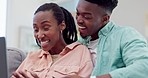 Happy black couple, laptop and online shopping in relax on living room sofa together at home. Excited African man and woman smile with credit card on computer in ecommerce, search or payment in house
