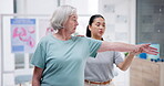 Elderly woman, physiotherapy doctor and stretching muscle, workout support or fitness in healthcare clinic. Medical, physical therapy or orthopedic consulting and helping senior patient with arm exam