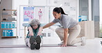 Physiotherapy, senior woman and stretching legs for recovery, exercise and healing from injury. Physical therapy, chiropractor and elderly person workout in rehabilitation, wellness and body health