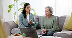 Finance, woman and senior with communication for life insurance, mortgage loan or retirement investment on sofa in home. Accounting, people and advice on financial budget for asset management or tax