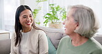 Happy, talking and a woman with a consultant for retirement planning, meeting and home care. Finance, help and a financial advisor speaking with a senior person on the sofa for legal advice together