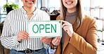 Happy woman, hands and open sign in small business, fashion design or clothing at boutique store. Closeup of creative female person or team holding label ready for service in retail shop or startup