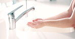 Water, soap and a person washing hands in the bathroom for health, hygiene or sustainability. Cleaning, skincare and remove bacteria with an adult in a home for wellness or natural disinfection