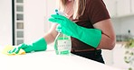 Cloth, hands and person cleaning table, home kitchen island or wipe dust, dirt or bacteria from desk. Chemical spray bottle, closeup disinfection service and cleaner labor, hygiene or washing counter