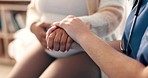 Pregnant woman on sofa with nurse holding hands for support, healthcare or medical advice for mother. Helping hand, trust or comfort, women on couch for together in pregnancy care with mom and doctor