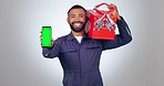 Mechanic man, green screen phone and smile on face in studio for tool box, promo or logo by white background. Engineer portrait, smartphone mockup and happy with maintenance app for handyman services