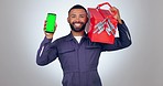 Mechanic man, green screen phone and studio with smile on face for tool box, promo or ui by white background. Engineer portrait, cell phone mockup and happy with maintenance app for handyman services