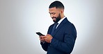 Businessman with smile, phone and typing in studio, reading email, online chat or business website for networking. Happy man, smartphone and scroll on social media, meme or app on white background.