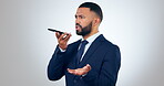 Professional, serious and man with phone on speaker for business networking, voice audio and talk in studio on white background. Communication, person and argue with smartphone for chat and career