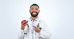 Doctor pointing at apple, nutritionist and health, man and face with healthcare and diet on white background. Nutrition, fruit and healthy food with wellness, lose weight and portrait in studio