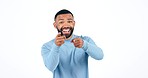 Face, pointing to you and man with motivation, smile or support on a white studio background. Portrait, person or model with hand gesture, excited or accountability with winner, emoji or mockup space