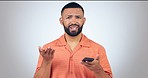 Phone, stress and face of man in studio with wtf, text or fake news comment on grey background. Smartphone, portrait and guy model frustrated by 404 error, glitch or phishing, social media or hacker
